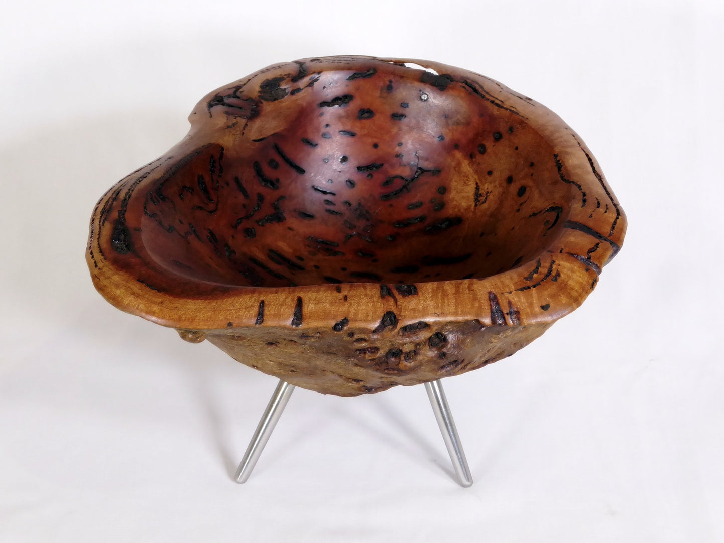 Burl bowl on stainless steel legs